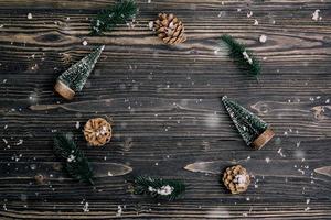 Christmas holiday composition decoration on wooden background, new year and xmas or anniversary with presents on wood table in season, top view or flat lay. photo