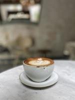 Hot coffee cup on table photo