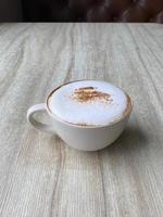 Hot coffee cup on table photo