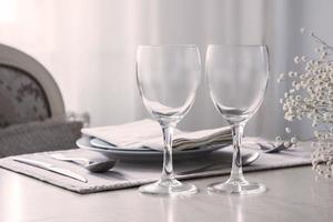 Pair of wine glasses on the wedding table, mockup photo