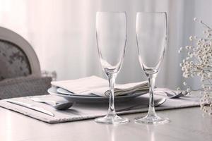 Pair of wine glasses, champagne flutes on the wedding table, Mockup