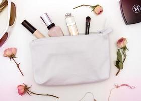 Close up of cosmetic bag with makeup stuff photo