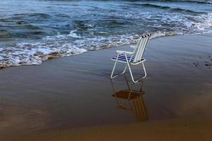 Chair on the Mediterranean Sea photo