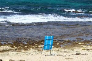 Chair on the Mediterranean Sea photo