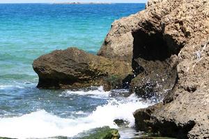 High cliffs on the shores of the Mediterranean Sea photo