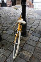 Bicycle stands on the street in a big city photo