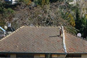 Red tiled roof on a residential building in Israel photo