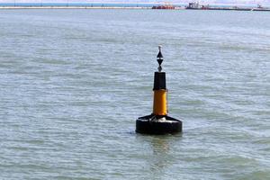 Lighthouse - a means of navigational equipment on the coast of large reservoirs photo