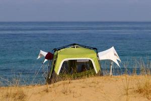 Tourist tent on the Mediterranean coast. photo