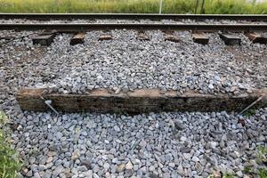 A road with rail tracks intended for the movement of railway rolling stock. photo