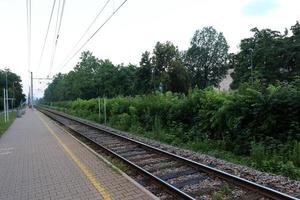 A road with rail tracks intended for the movement of railway rolling stock. photo