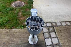 Ashtray - a container for tobacco ash, cigarette butts, cigars. photo