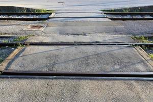 A road with rail tracks intended for the movement of railway rolling stock. photo