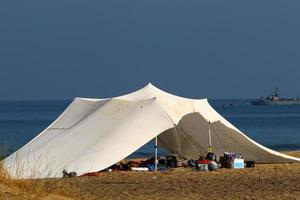 Tourist tent on the Mediterranean coast. photo