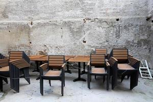 Table and chairs in a cafe in a city park photo