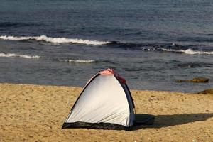 Tourist tent on the Mediterranean coast. photo