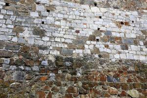 Stone wall of ancient Crusader fortress photo