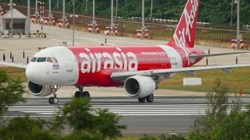 PHUKET, THAILAND DECEMBER 3, 2018 - AirAsia Airbus A320 HS BBH taxi to the runway for departure from Phuket airport. AirAsia is a Malaysian low cost airline. video