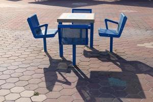 Chair and table in a cafe on the Mediterranean coast photo