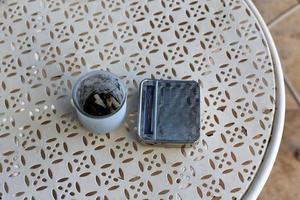 Ashtray - a container for tobacco ash, cigarette butts, cigars. photo