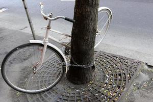 Bicycle stands on the street in a big city photo