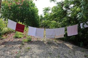 Laundry drying on the street in a big city photo