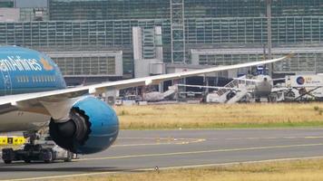 FRANKFURT AM MAIN, GERMANY JULY 17, 2017 - Vietnam Airlines Boeing 787 Dreamliner VN A863 towing by tractor from service. Fraport, Frankfurt, Germany video