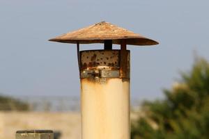 Chimney on the roof of the house photo