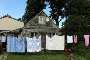 Laundry drying on the street in a big city photo