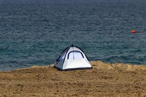 Tourist tent on the Mediterranean coast. photo