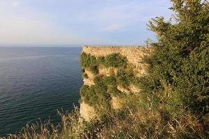 Stone wall of ancient Crusader fortress photo