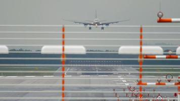 Widebody airplane approaching before landing at rainy weather in Dusseldorf Airport video