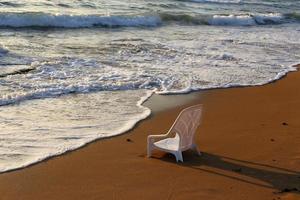Chair on the Mediterranean Sea photo