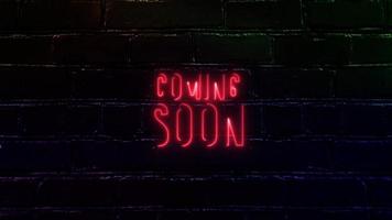 Coming Soon Neon Glow Text on Brick Background. video