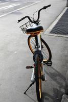 Bicycle stands on the street in a big city photo