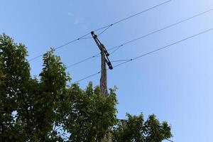 Electric pole and wires carrying current photo