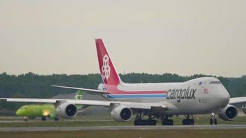 NOVOSIBIRSK, RUSSIAN FEDERATION JUNE 10, 2020 - Cargolux Boeing 747 taxiing at Tolmachevo Airport, Novosibirsk. Front view of a cargo carrier. Jumbo jet prepares to take off video