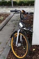 Bicycle stands on the street in a big city photo