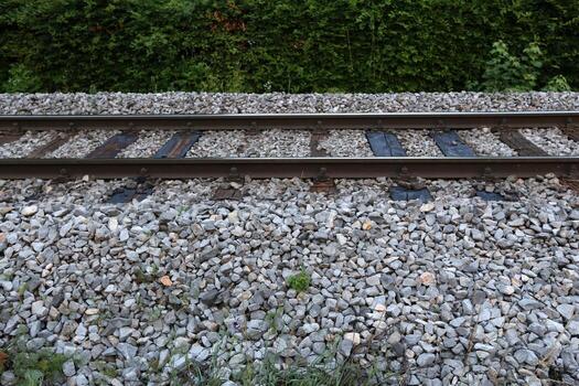A road with rail tracks intended for the movement of railway rolling stock. photo