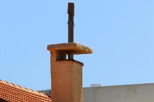 Chimney on the roof of the house photo