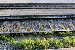 A road with rail tracks intended for the movement of railway rolling stock. photo