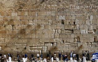 Notes in the Wailing Wall in Jerusalem with their requests and desires addressed to God. photo