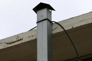 Chimney on the roof of the house photo