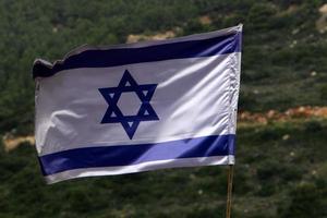 Israeli blue and white flag with the Star of David photo