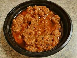 Ethiopian dish of raw tuna fish with butter in container photo