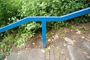 blue railing on the stairs in the park photo