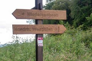 wooden direction sign photo