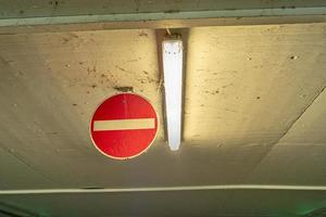 information and signs in a parking garage photo