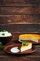 Homemade cottage cheese casserole on rustic wooden background