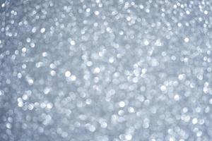 Abstract blurred fancy silver and white glitter sparkle confetti for background usage photo